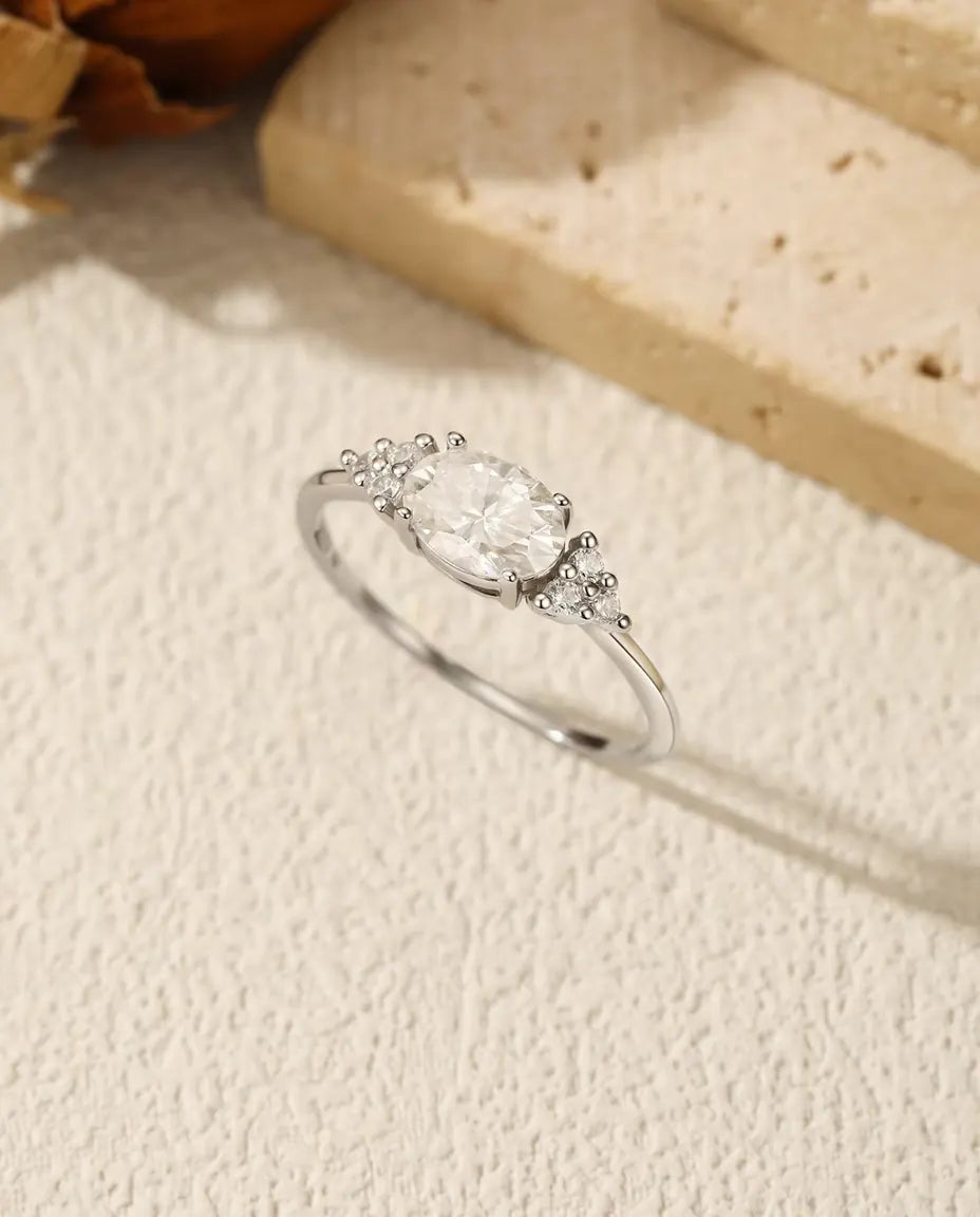 Oval Moissanite Engagement Ring - 1 Carat D Colour VVS Solitaire in 925 Sterling Silver, Zirconia Side Clusters, Sizes 5-9