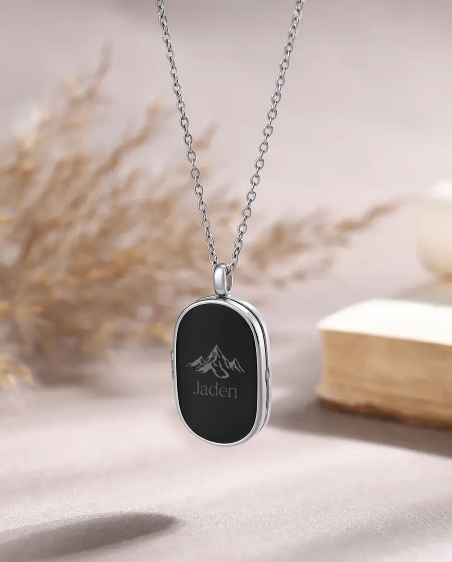 Personalised men's photo locket necklace with engraved mountain and name Jaden, black oval pendant on silver chain
